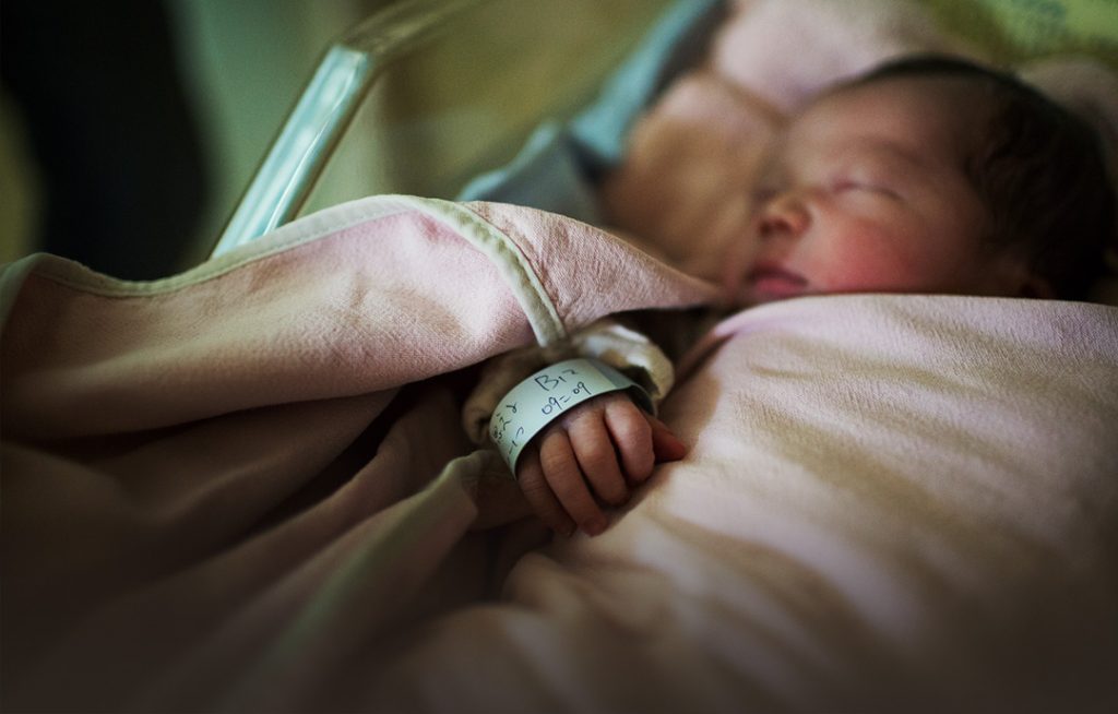 Injured newborn baby sleeping in hospital